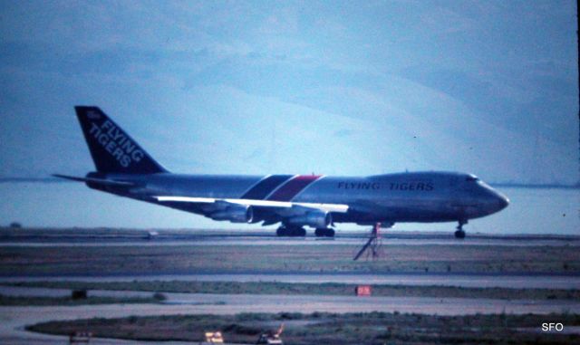 Boeing 747-200 (N815FT) - San Francisco,CA KSFO - Flying Tiger Boeing 747 moving to position and hold on 28R at SFO for a flight to Kai Tak(HKG)- 1000mm lens on color slide/35mm film
