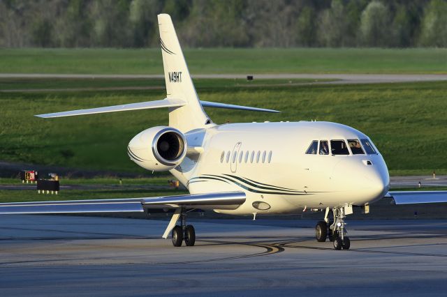 Dassault Falcon 2000 (N49HT) - On an early evening at Atlanta's PDK airport this Falcon was taxiing to the runway for departure. With the sun being so low, the light was illuminating the jet beautifully. I shot this with my Canon 300mm F2.8 lens. The shutter speed was 1/2000, F5 (I had the aperture fairly low to blur the background), ISO 800. Please check out my other aviation photography. Votes and comments are always appreciated. Questions about this photo can be sent to Info@FlewShots.com