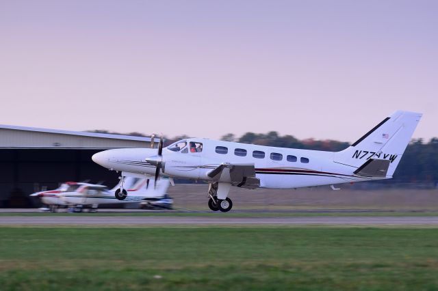 Cessna Conquest 2 (N771XW) - Dusk departure on runway 26