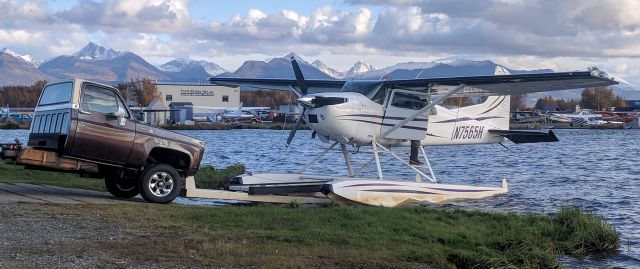 Cessna Skywagon (N7565H) - 185 landing and being hauled to the paved taxiway on a choppy afternoon