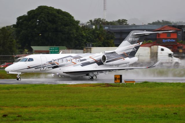 Cessna Citation Longitude (N616NP) - EJM700 departing a wet RWY25 to Sugarland.