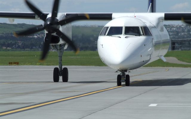 de Havilland Dash 8-400 (C-FOEN) - Tail 401 arriving at YYC, July 2013.