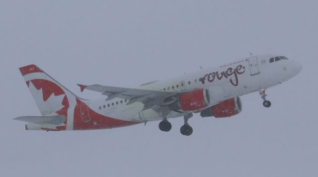 Airbus A319 (C-GBIM) - Air Canada Rouge Airbus A-319-100 (C-GBIM) de-iced and departing a snowy YOW on Runway 07 for MCO as Air Canada 1692 on 26 Jan 23