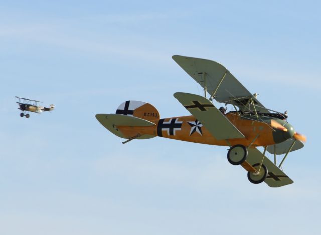 — — - An Albatross of the Luftwaffe performs a flypast at Duxford Air Museum.