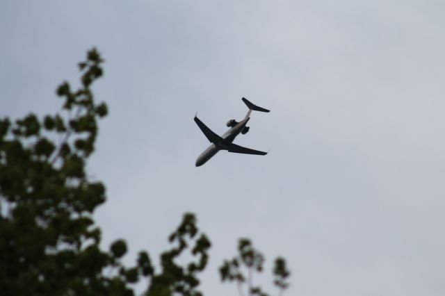 Canadair Regional Jet CRJ-700 (N510AE) - PSA 5401 from KPHL about to disappear behind the tree.