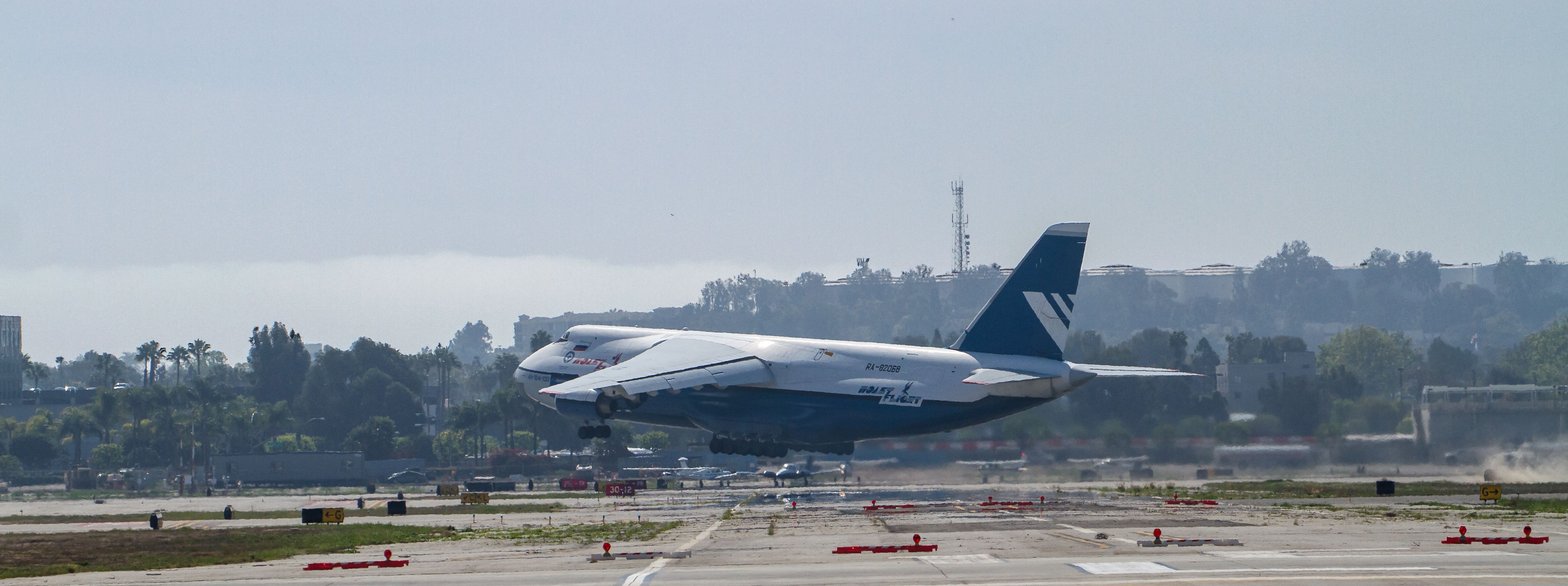 — — - Polet Airlines Antonov An-124 lifts off RY 12 at Long Beach on Feb 21, 2014.  Note the dirt being stirred up on the right side of the photo.