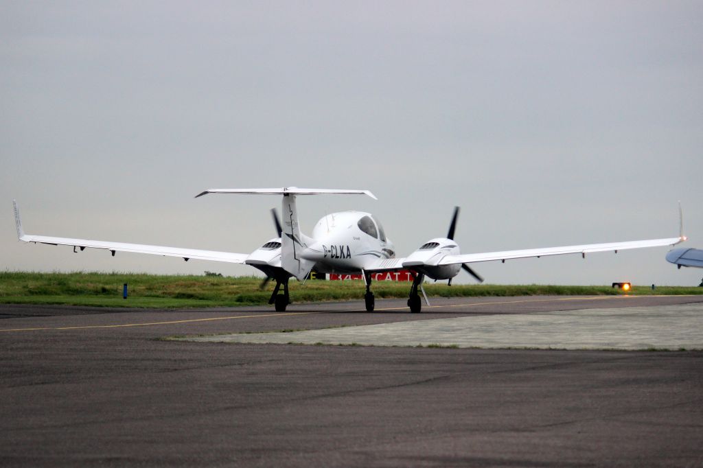 Diamond Twin Star (G-CLKA) - Taxiing to depart rwy 34 on 4-Sep-21.