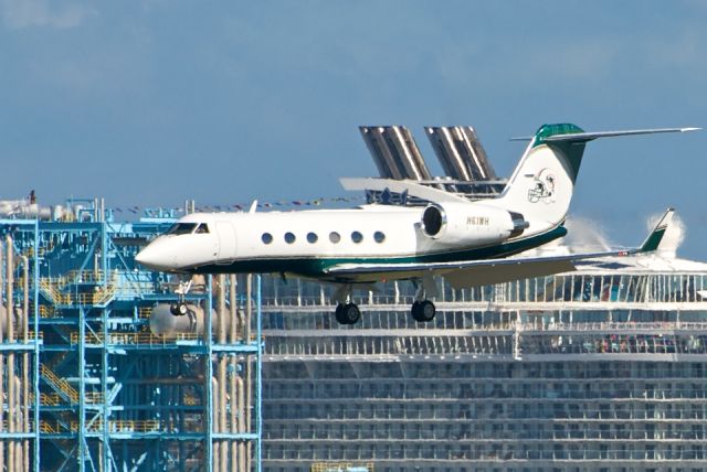 Gulfstream Aerospace Gulfstream IV (N61WH) - One of several planes of the Miami Dolphins Air Force with the "Oasis of the Seas" in the background.