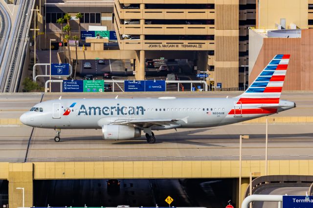 Airbus A320 (N604AW) - An American Airlines A320 taxiing at PHX on 2/13/23, the busiest day in PHX history, during the Super Bowl rush. Taken with a Canon R7 and Canon EF 100-400 II L lens.