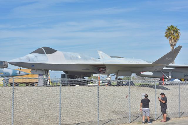 87-0801 — - Thanks for ruining my shots guys! Anyway, the YF-23 is one strange looking bird. This one has/had different engine than the one on display at WPAFB NMOTAF. This has a GE engine, the one in Dayton has P&W. Now I have seen both YF-23's! Wish they had the money to build a suitable hangar/museum to shelter this and the YF-17 and other birds from the elements.