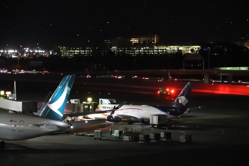 Boeing 737-800 (XA-ADU) - KSFO - Aeromexico 737- at the International Terminal along side Cathay Pacific A350 B-LRK. The fire rig was returning from an incident next to an Avianca Airbus and a jetBlue Airbus parked in the remote slot out of view to the right. I was surprised at how many red lights the Fire rig had all around the truck. Boeing CN:61799 LN:6591br /Type 737-852br /First flight date 13/09/2017br /This photo March 9th, 2018.