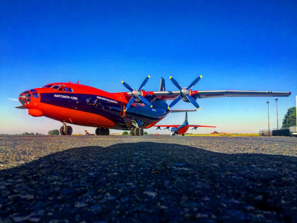 Antonov An-12 (UR-CKL) - This Antonov AN-12, along with its sister airplane UR-CNN in the back, came in from St. Johns, Newfoundland to drop some cargo.