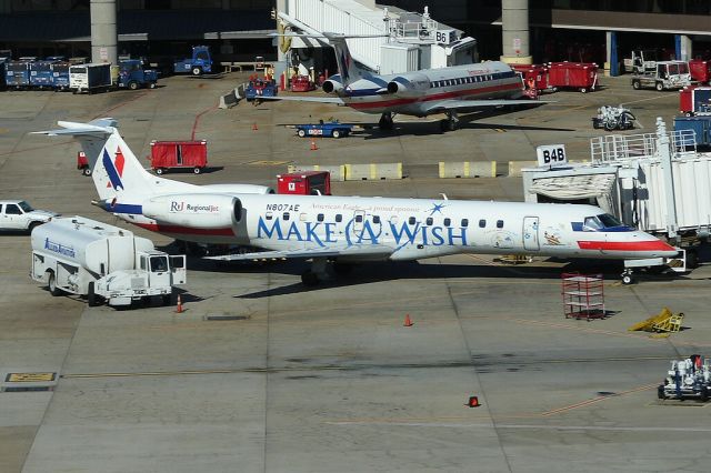 Embraer ERJ-135 (N807AE) - American Eagles "Make A Wish" special scheme in DFW. Photo taken from the SkyLink train.