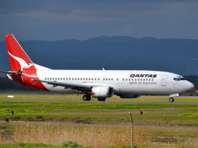 BOEING 737-400 (VH-TJS) - On taxi-way heading for take off on runway 05. Thursday 12th July 2012.
