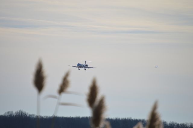 Embraer ERJ-135 (N27962) - Short final for 06L.