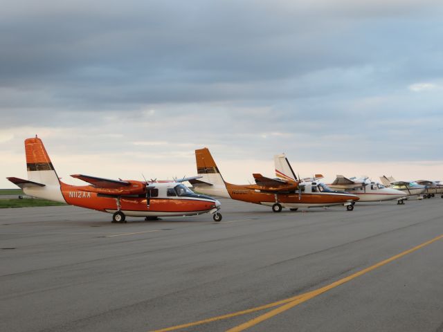 Aero Commander 500 (N112AA) - Three fire spotting/command birds waiting for their season to start.