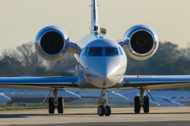 Gulfstream Aerospace Gulfstream V (N728AG) - GV taxiing at PDK airport in Atlanta during Super Bowl week 2019. Notice billionaire's row of jets in the background. Questions about this photo can be sent to Info@FlewShots.com