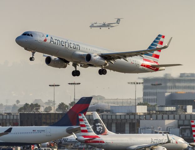 Airbus A321 (N133AN) - AAL126 climbs off runway 25R at LAX bound for Chicago OHare