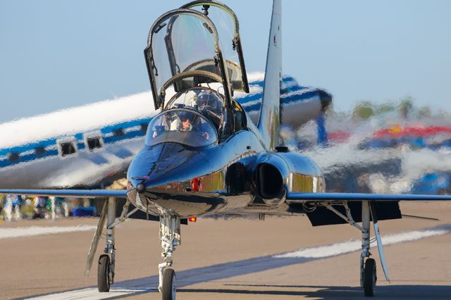 Northrop T-38 Talon — - T-38 trainer taxiing with a DC-3 in the background at Sun N Fun. Questions about this photo can be sent to Info@FlewShots.com