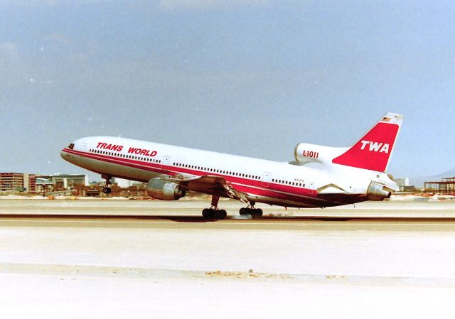 Lockheed L-1011 TriStar (N31014) - KLAS - July 1995 - 115 degrees and smokin.......E Sunset Blvd Airpark is a neat place to film. I used my F-150 and 8ft ladder in the back  of the bed to clear the fence line - 3 - 1 gallon jugs of water and done by noon - scorching hot at Vegas...must see TV!