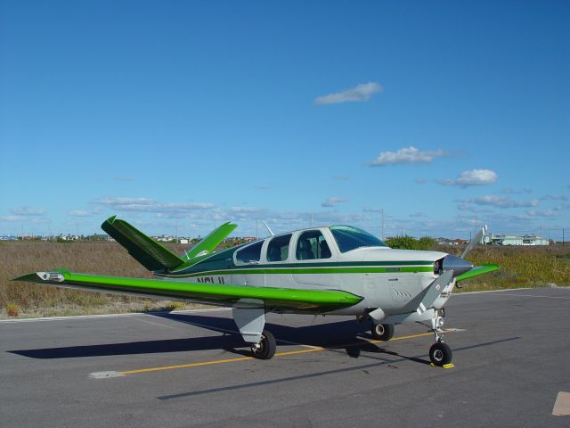 Beechcraft 35 Bonanza (N61JL) - On the ramp at Port Aransas