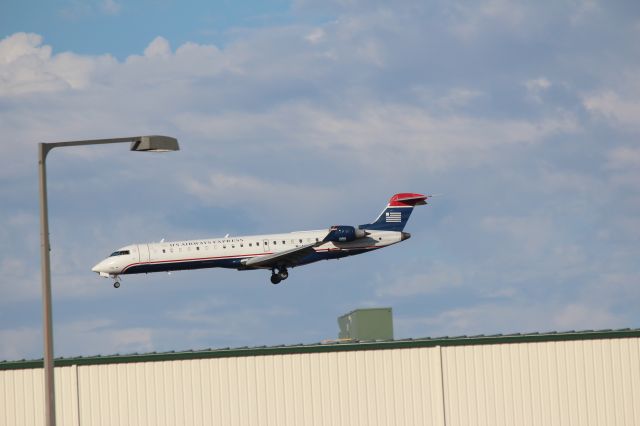 Canadair Regional Jet CRJ-700 (N718PS) - 111012 US Airways Express on final for Rwy 19R from the maint facility