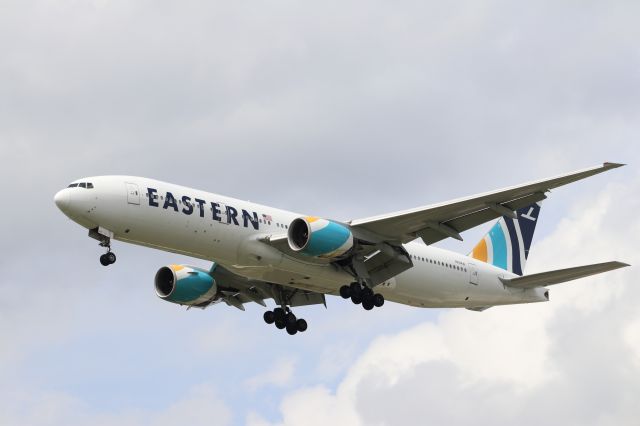 Boeing 777-200 (N825KW) - Beautiful Eastern Airlines 777-200ER making a rare approach to RWY 23R. Chartered by Natl. Guard