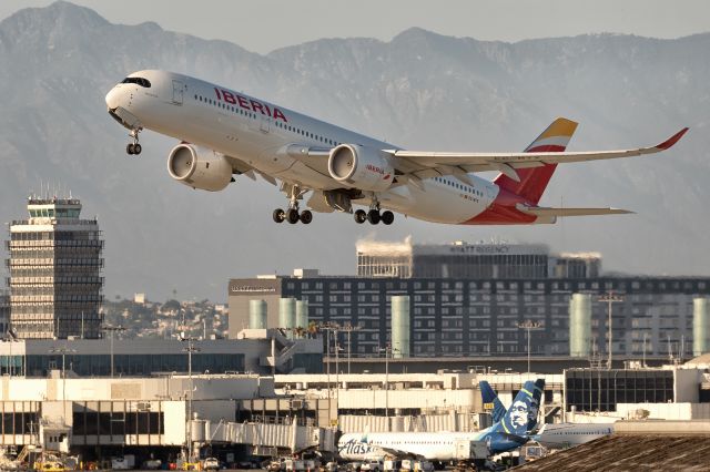Airbus A350-900 (EC-MYX) - 12th August, 2024: Flight IB 6170 bound for Adolfo Suárez Madrid-Barajas climbing - past the Hyatt Regency hotel - from runway 25R at LAX. 