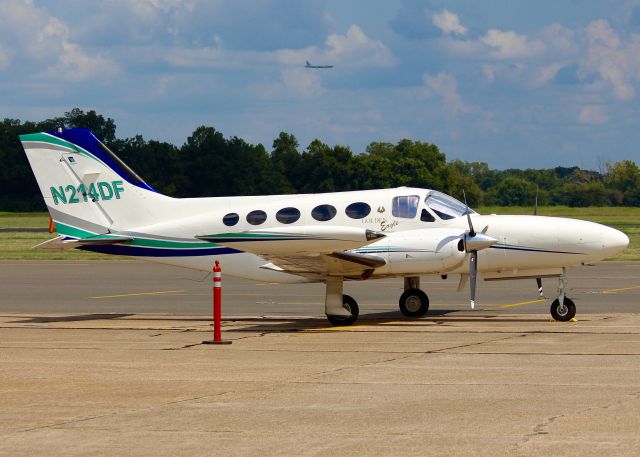 Cessna 421 (N214DF) - At Downtown Shreveport. Even get a B-52 in the background on final for runway 15 at Barksdale AFB.