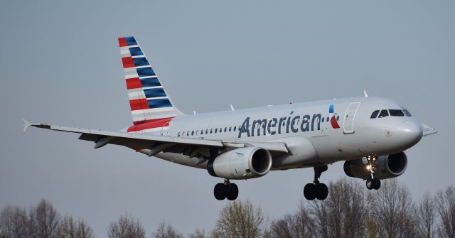 Airbus A319 (N822AW) - A little windy St. Patricks Day spotting for me - this A319 puts on a show landing on a gusty 18C.  On 3/17/18.