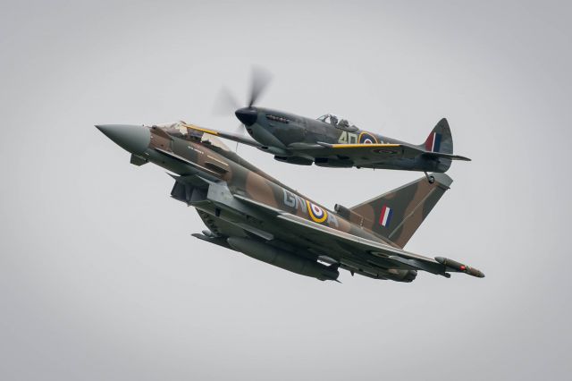 — — - The commemorative Typhoon as part of a synchro pair with a Battle of Britain Memorial Flight Supermarine Spitfire