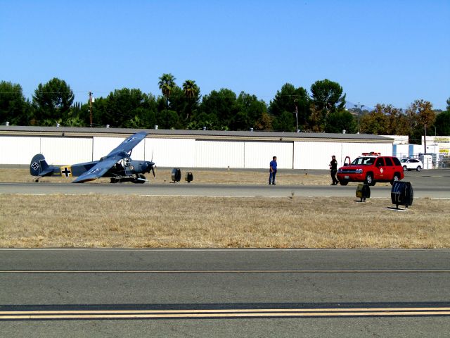 N156BP — - Fire personnel making contact with the pilot of a 2019 Slepcev Storch kit built experimental aircraft after its right landing gear collapsed after landing on RWY 24 10/10/2021.