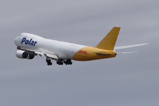 BOEING 747-8 (N853GT) - Takeoff viewed from west side of Runway 15-33, with wingtip vortices