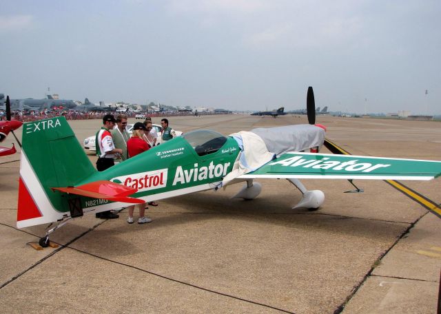 EXTRA EA-300 (N821MG) - Mike Goulian talking to people before his demo at the Defenders of Liberty Airshow at Barksdale Air Force Base.