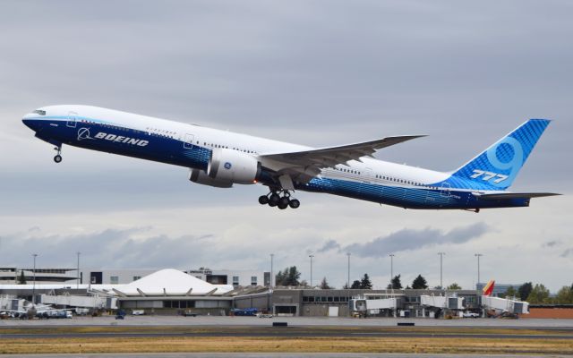 BOEING 777-9 (N779XW) - Boeing's first 777X is visiting Spokane International Airport for flight testing.  Here it is taking off after a short rain with a tail skid attached. I was on top of my car shooting over the fence.