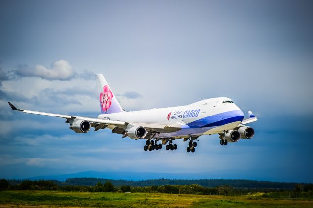 Boeing 747-400 (B-18719) - Anchorage, Alaska, June 10, 2015. China Airlines Boeing 747-400 arrives from New Yorks John F Kennedy (KJFK) for a brief fuel stop en route to Taipai, Taiwan. The weather was schizophrenic all day, but there were brief moments where the sun made the colors of the landscape explode like they do here. br /©Bo Ryan Photography | a rel=nofollow href=http://www.facebook.com/boryanphotowww.facebook.com/boryanphoto/abr /br /If you like my work, please vote! Thanks for looking! 