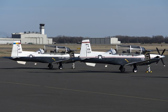 Raytheon Texan 2 (01-3629) - A pair of T-6A Texan II, on the ramp. One from Pensacola NAS, FL (AP), and one from Vance AFB, OK. -February 2014