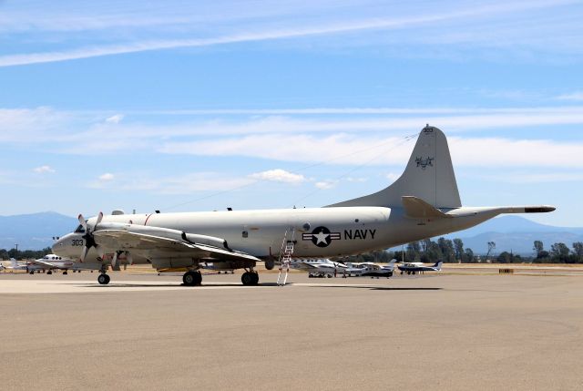 Lockheed P-3 Orion (16-3294) - KRDD - since I know all of the vantage points at RDD - I drove into the parking lot at Redding Air Services and found the P-3 sitting perfect between the 2 buildings. The air-stairs were a cool added bonus as the Sqdn 30 crew of 5 was off to lunch - hopefully at the Redding Air terminal and upstairs at the nice restaurant they have there. The Unit decal on the tail looks like 3 pit-bulls in a triangle facing forward - reminds me I dont miss my meter reading days! So cool to see this P-3C here at Redding today and totally by accident. VX-30 VX-30 a rel=nofollow href=http://www.navair.navy.mil/nawcwd/vx30/http://www.navair.navy.mil/nawcwd/vx30//a