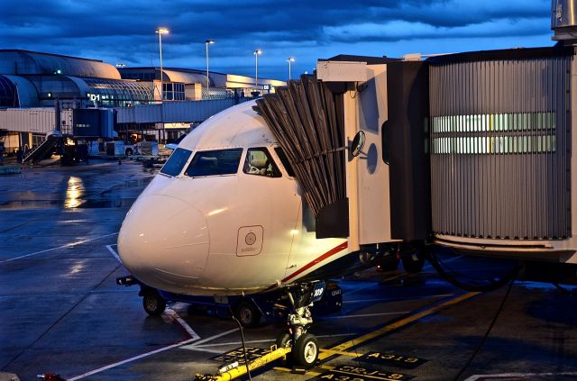 Airbus A320 (N109UW) - At the gate between rain showers after arrival from FLL.