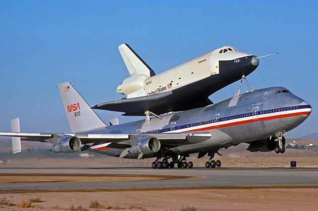 BOEING 747-100 (N905NA) - Boeing 747-SCA N905NA takes off from Runway 04 with Enterprise at the beginning of the fourth Approach and Landing Test (ALT-4) at 8:00 A.M. on October 12, 1977. The American Airlines heritage of the 747-SCA was still apparent. Its Boeing construction number is 20107. It made its first flight on October 15, 1970 and was delivered to American Airlines as 747-123 N9668 two weeks later.