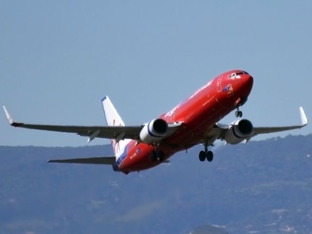 Boeing 737-800 (VH-VOK) - Lift off from runway 23.