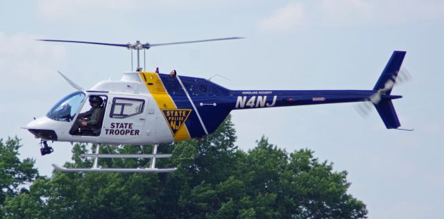 Bell JetRanger (N4NJ) - LINDEN AIRPORT-LINDEN, NEW JERSEY, USA-JUNE 13, 2024: A New Jersey State Police helicopter is seen by RF at approximately 1540 hrs. preparing to land to take on fuel.