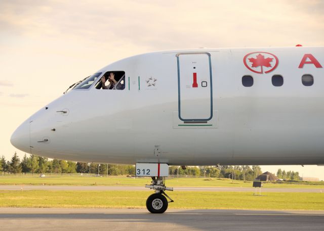 Embraer ERJ-190 (C-FHJJ) - The captain was so happy that he opened the window and waved at us all.