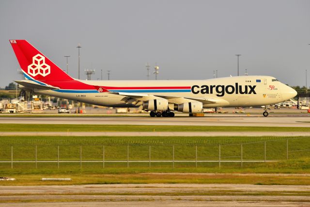 Boeing 747-400 (LX-RCV) - Thrust Reversers deployed, slowing down and rolling out on 23-L on arrival from ORD 09-19-21 during golden hour?