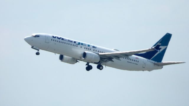 Boeing 737-800 (C-FUCS) - Shown here shortly after take off is a WestJet Boeing 737-800 in the Spring of 2017.