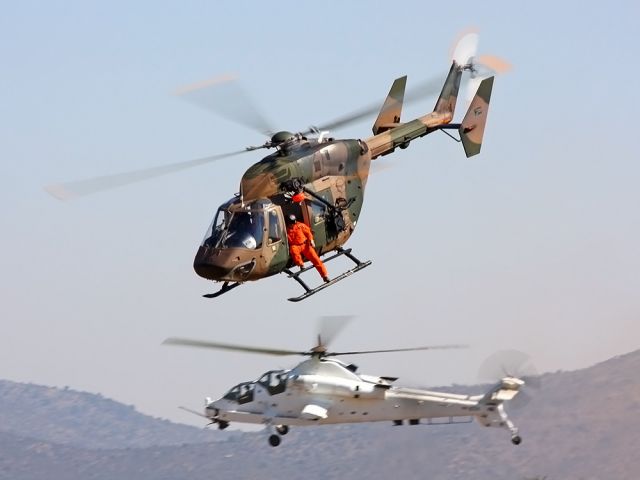 — — - South African Air Force BK117 and a Rooivalk AH2 in UN livery