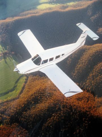 Piper Saratoga (VH-MNV) - Plan View shot from a C170 Camera Ship.  Lance is sporting a new paint scheme.  Location is approaching the Great Dividing Range in Australia