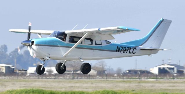 Cessna 205 (N797LC) - Over runway one-two, at KMCE