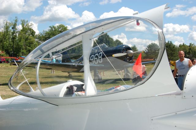 — — - Wings & Wheels 2016! Sloas Field. Cool shot of WWII vintage Navy SNJ (I think) through the canopy of a Homebuilt