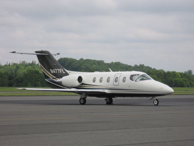 Beechcraft Beechjet (N477FL) - Parked at Concord Regional Airport (pic taken by HunalinkJr) - 6/16/09